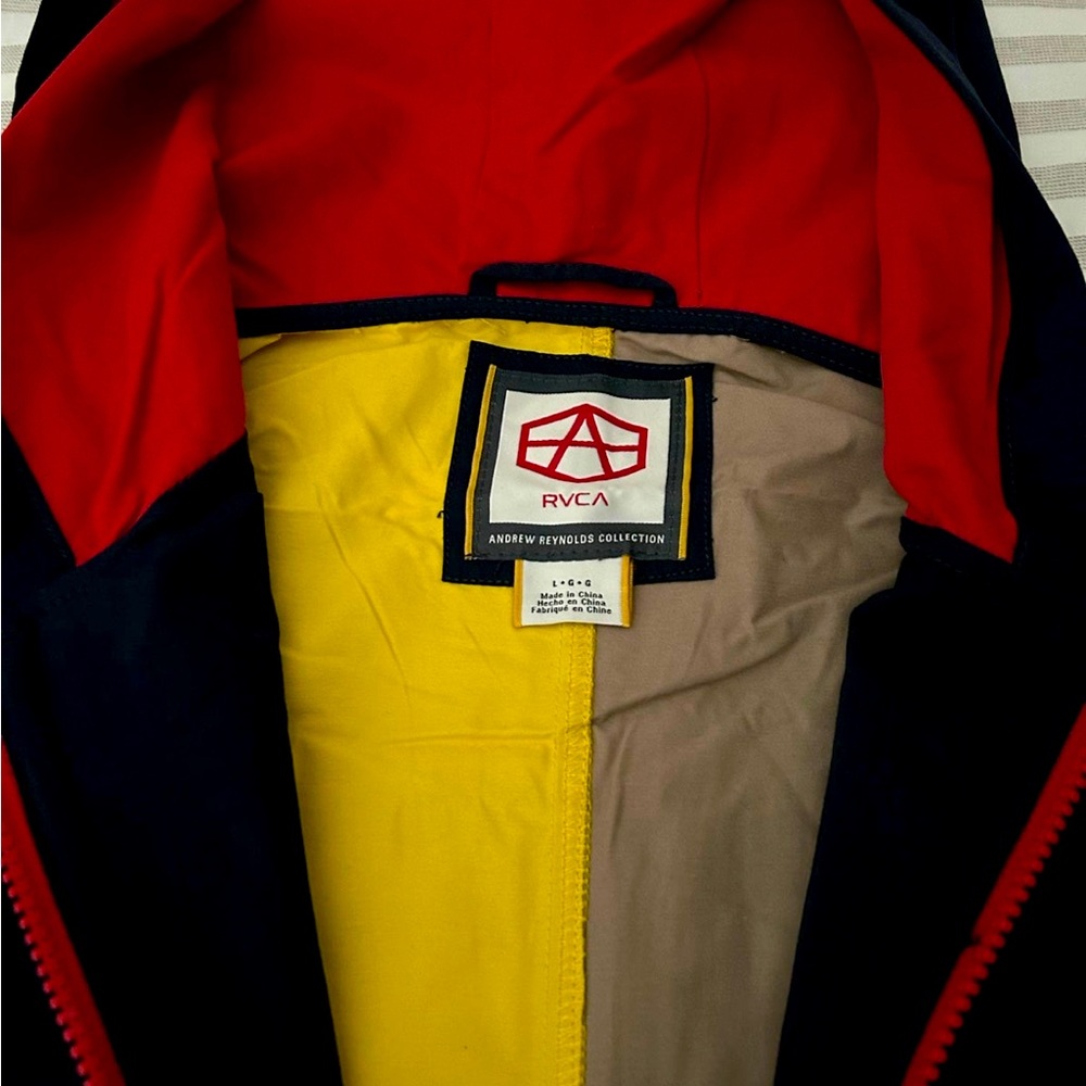 Athletic apparel multi color hooded jacket